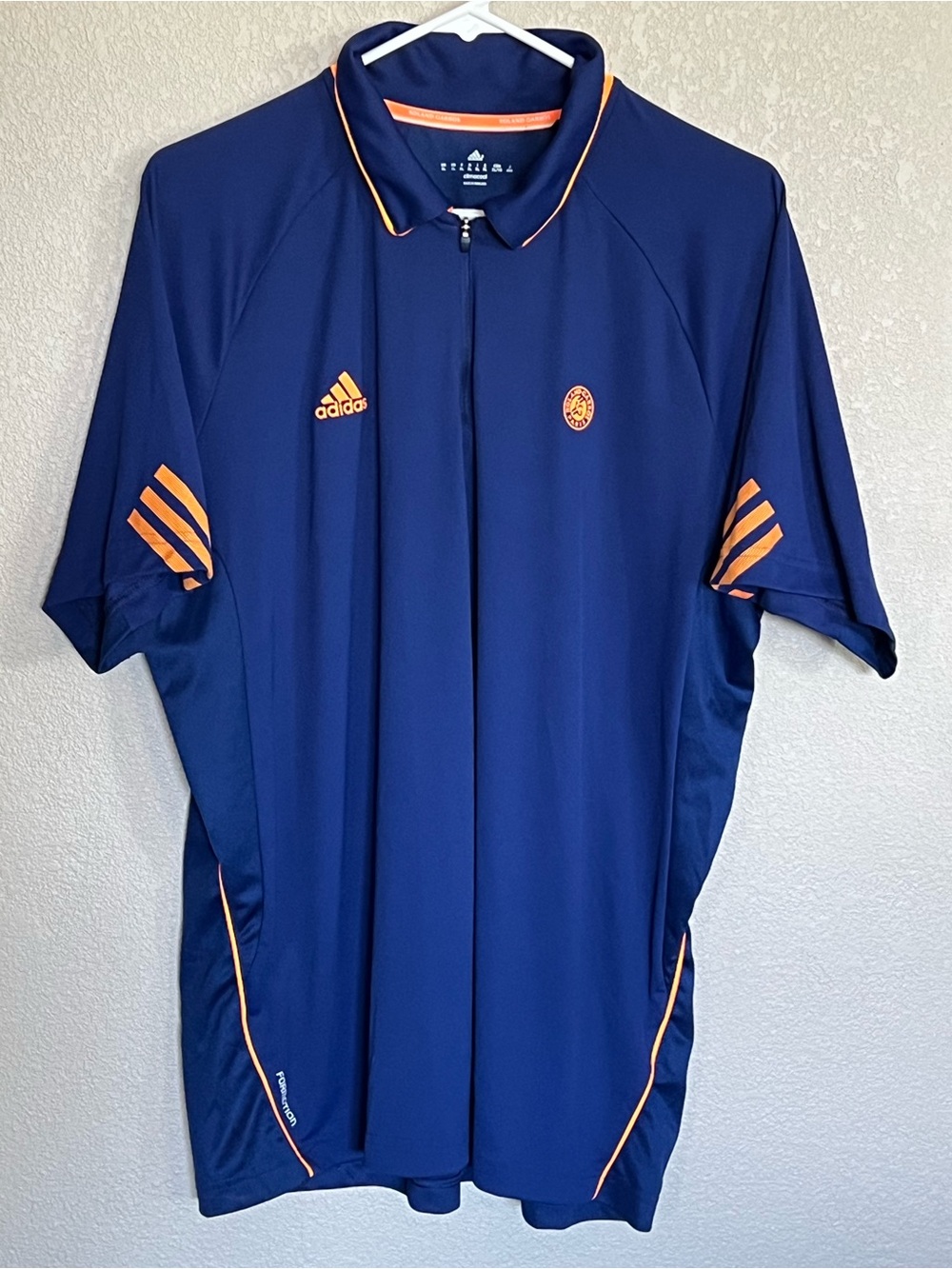 adidas Roland Garros Climacool Menโs Navy Polo with Orange Accents